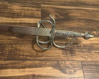 M68 - $60. Decorative Sword. Stamped "Toledo". Measures 41" long. 