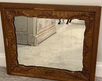M49 - $30. Antique Framed Wall Mirror. Measures 23" x 27". Currently can only be hung horizontally as photographed. Does have a few missing decorative pieces. 