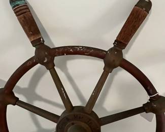 M43 - $175. 24" Ships Wheel. Brass with Wood Handles Ships Wheel with the name Gen. & Mar. Tr. Amsterdam in the middle. Measures 24" across.  