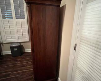 M104 - $100. Entertainment Center by Universal Furniture. Measures 59" wide x 23" deep x 69" tall. Located right inside the front door - PLEASE have help to move this. 
