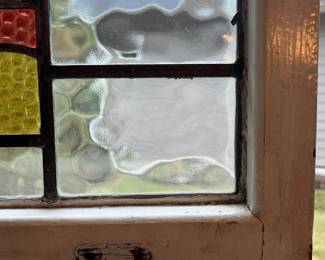 M3 - $75. Stained Glass with hooks to hang in the window. Measures 20" x 15". Has crack & hole in top center clear panel. 