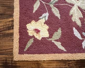 M52 - $50. Capel Runner. Measures 95" x 29". "Antique Florals in Mahogany". Has been used inside the front door so it does show some signs of wear 