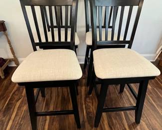 M88 - $160. Set of 4 Counter Height Stools. Measures 19" wide x 25" floor to seat x 42.5" to seat back.  They do "swivel" but its more just to get off not to swing back and forth. 