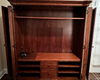 M104 - $100. Entertainment Center by Universal Furniture. Measures 59" wide x 23" deep x 69" tall. Located right inside the front door - PLEASE have help to move this. 
