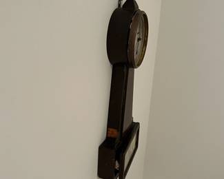 M46 - $25. Sessions Clock. Eight Day Lever Time. Mahogany Finish Case. Measures 7.5" wide x 23.5" tall. 