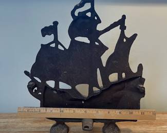 M12 - $35. Cast Iron Ship Door Stop. Measures 11" wide x 12" tall. 