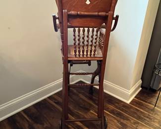 M63 - $50. Antique High Chair / Stroller Combo. Measures 17.5" wide x 21" deep as highchair (x 36" deep as a stroller ) x 39.75" tall as a highchair (32" tall as a stroller) 