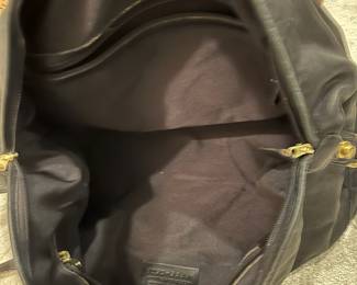 M115 - $140. Vintage COACH Black Leather Duffle Back. Measures 22" x 9" x 18". 