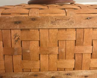 M69 - $40. 2005 Longaberger Large Boardwalk Basket with Leather Handles. Has plastic insert. Measures 18" wide x 10" x  12" tall (+ handles.)