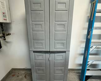 M135 - $40. Plastic Garage Storage Cabinet. Measures 27" x 16" x. 65" tall. 