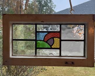 M3 - $75. Stained Glass with hooks to hang in the window. Measures 20" x 15". Has crack & hole in top center clear panel. 