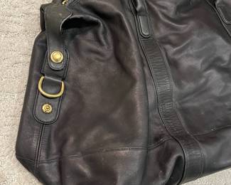 M115 - $140. Vintage COACH Black Leather Duffle Back. Measures 22" x 9" x 18". 