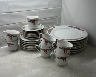 M94 - $30. Poinsettia Ribbons China. 8 Dinner plates. 8 Salad Plates. 7 cups & saucers. 