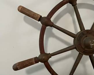 M43 - $175. 24" Ships Wheel. Brass with Wood Handles Ships Wheel with the name Gen. & Mar. Tr. Amsterdam in the middle. Measures 24" across.  