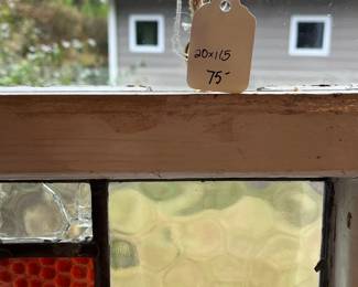 M3 - $75. Stained Glass with hooks to hang in the window. Measures 20" x 15". Has crack & hole in top center clear panel. 