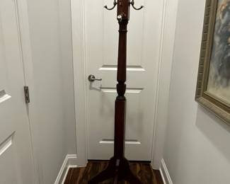 M64 - $50. Wooden Coat Tree. Base is 23" x 65" tall. 