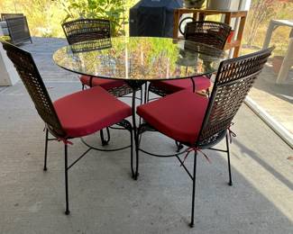 M76 - $140. Glass top patio table with chairs. Table is 42" across x 30" tall. Chairs are 18" wide x 16" X 36" tall. No name that we can find. Table wicker and chairs show some wear but still sturdy & usable! 