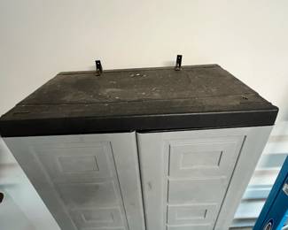M135 - $40. Plastic Garage Storage Cabinet. Measures 27" x 16" x. 65" tall. 