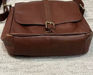 M110 - $25. Vintage Fossil Brown Leather Crossbody. Measures 11" x 3.25" x 10". 