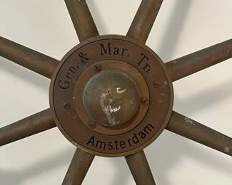 M43 - $175. 24" Ships Wheel. Brass with Wood Handles Ships Wheel with the name Gen. & Mar. Tr. Amsterdam in the middle. Measures 24" across.  