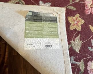 M52 - $50. Capel Runner. Measures 95" x 29". "Antique Florals in Mahogany". Has been used inside the front door so it does show some signs of wear 