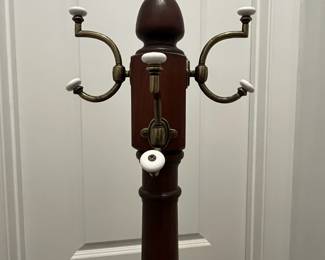 M64 - $50. Wooden Coat Tree. Base is 23" x 65" tall. 