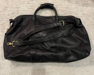 M115 - $140. Vintage COACH Black Leather Duffle Back. Measures 22" x 9" x 18". 