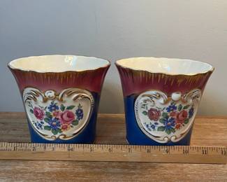 M5 - $45. PAIR Painted Cachepots. Measures 5.75" across x 4.75" tall. They do have some very minor chipping. 