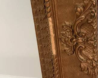 M49 - $30. Antique Framed Wall Mirror. Measures 23" x 27". Currently can only be hung horizontally as photographed. Does have a few missing decorative pieces. 