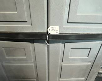 M135 - $40. Plastic Garage Storage Cabinet. Measures 27" x 16" x. 65" tall. 