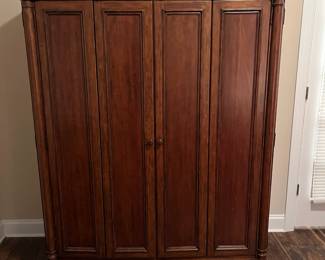 M104 - $100. Entertainment Center by Universal Furniture. Measures 59" wide x 23" deep x 69" tall. Located right inside the front door - PLEASE have help to move this. 