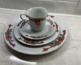 M94 - $30. Poinsettia Ribbons China. 8 Dinner plates. 8 Salad Plates. 7 cups & saucers. 