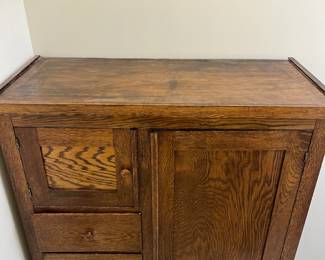 M62 - $225. Antique Oak Chifferobe. Measures 40" wide x 18" deep x 61" tall. Long door has been repaired on the bottom right corner. All drawers slide easily as they should!