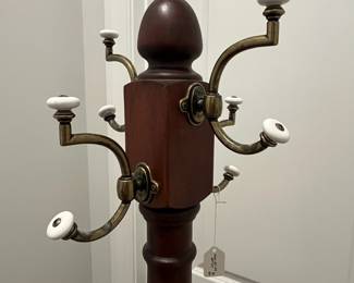 M64 - $50. Wooden Coat Tree. Base is 23" x 65" tall. 