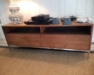 Crate & Barrel media console in walnut with stainless steel base