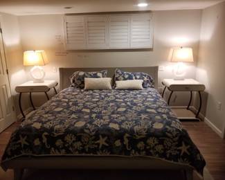 King bedroom suite: king bed (shown dressed); end tables by Century; Ring Form alabaster table lamps by Chapman & Myers, for Visual Comfort Signature