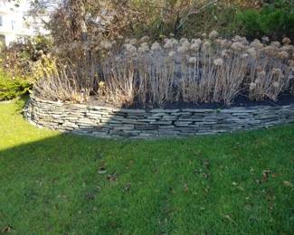 Stacked stone garden wall