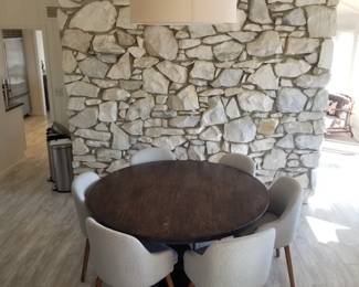 Round dining table with 6 chairs by West Elm