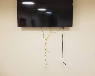 Flat screen TV with mounting bracket