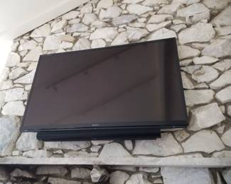 Flat screen TV with mounting bracket; sound bar