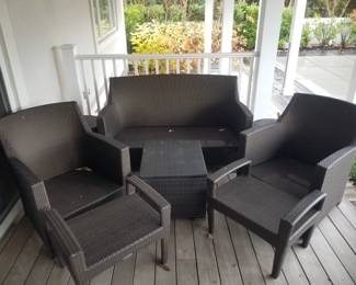 8-piece all-weather conversation set by DEDON. Couch; two accent table; two chairs; two footstools; one cooler table 