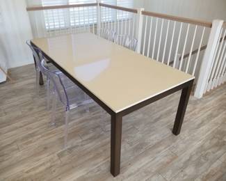 Contemporary dining table is 7 feet long x 38" wide