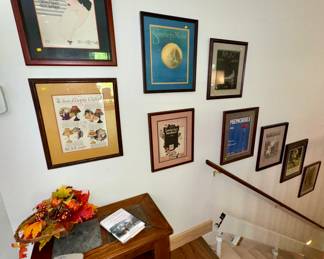 Framed antique sheet music covers