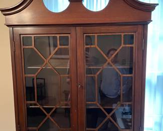 #17 Chippendale-style "mahogany" secretary bookcase with slant front writing desk. Ball and claw feet. 3 drawers, 2 doors, 2 shelves. (79h x 29w x 16d) $165.00