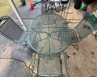 #63 Green Wrought Iron Oval Patio table and 4 bouncer chairs - *as is wear* $150.00