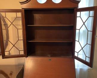 #17 Chippendale-style "mahogany" secretary bookcase with slant front writing desk. Ball and claw feet. 3 drawers, 2 doors, 2 shelves. (79h x 29w x 16d) $165.00