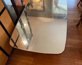 #12 Art Deco-style mirrored coffee table with a glass top and gold metal/brass color trim. 30 x 49 x 16h $20.00