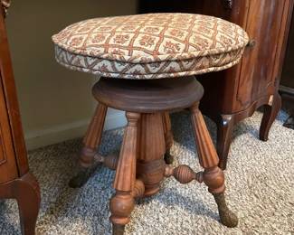 #13 Antique Holtzman and Sons Piano Stool with brass foot and carved wood. - adjustable. As is wea and repairs.. Restored in 1972. 20.5"tall (adjustable lower) 19.5 width $65.00