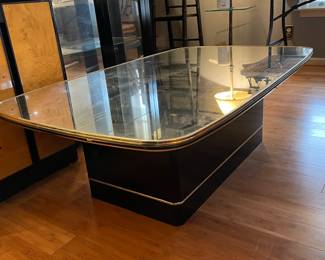 #12 Art Deco-style mirrored coffee table with a glass top and gold metal/brass color trim. 30 x 49 x 16h $20.00