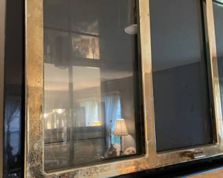 #5 living room Henredon circa 1990 lighted bar cabinet. Black lacquer, brass, mahognay burled wood, four doors, three drawers.(as is finish pictured) 82 x 19 x 27 $1,500.00